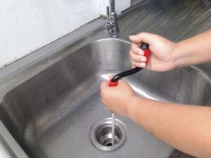 Woman's hand are breaking through the pipes.