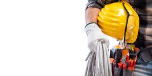 Electrician with tool belt on a white background. Electricity.