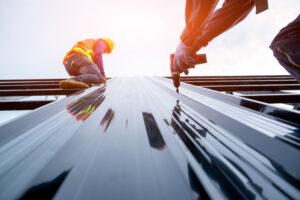 Roofer worker in protective uniform wear and gloves