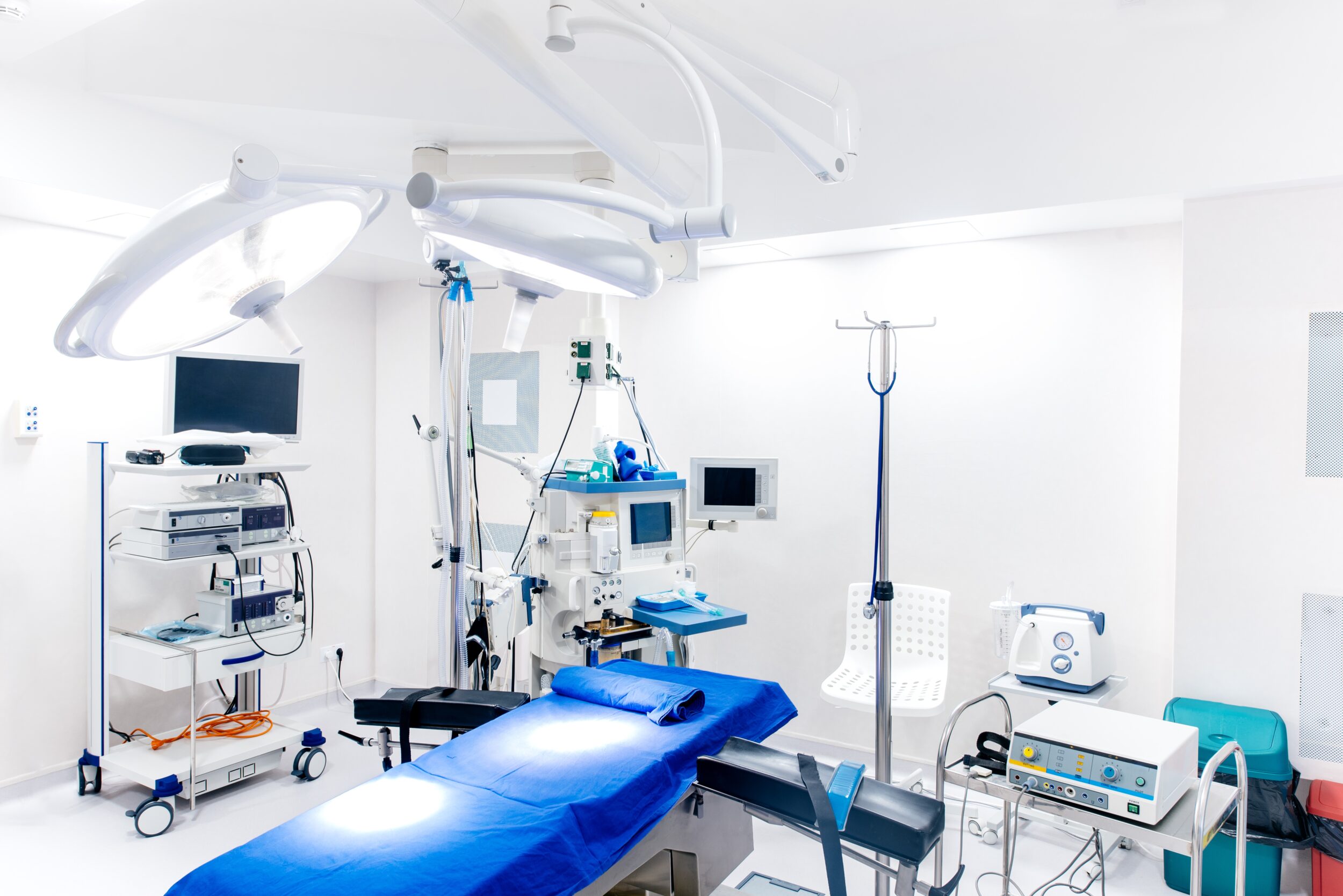 Medical devices and industrial lamps in surgery room of modern hospital