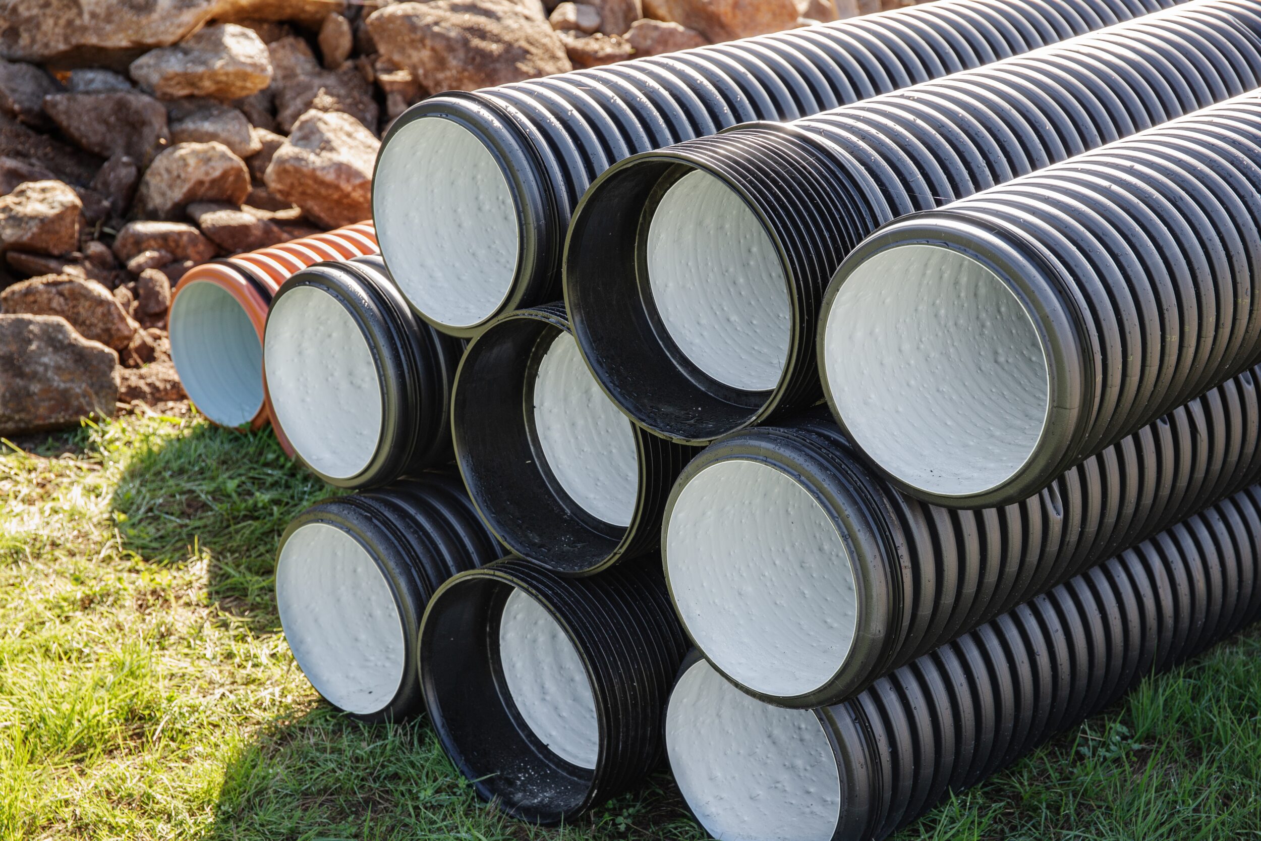 Pile of Polyethylene drainage pipes on outdoors