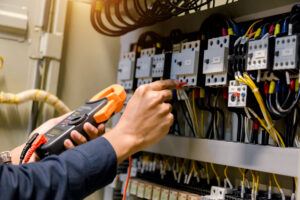 Electrician engineer work  tester measuring voltage