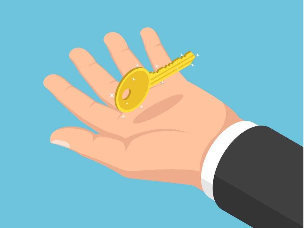 hand holding a key signifyiong key benefits of job tracking scheduling software