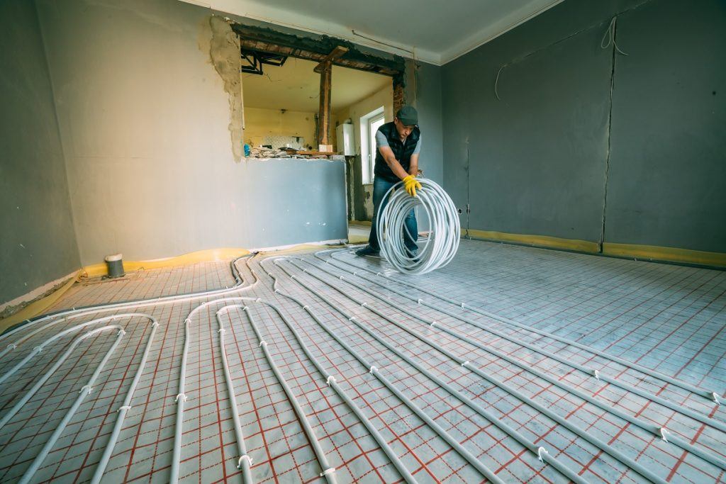 Customer Financing example with man laying underfloor heating