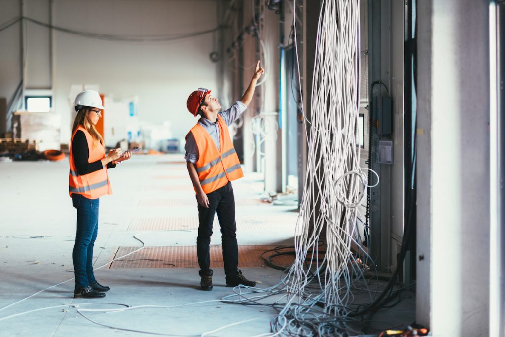 maintenance management team checking wires in a building