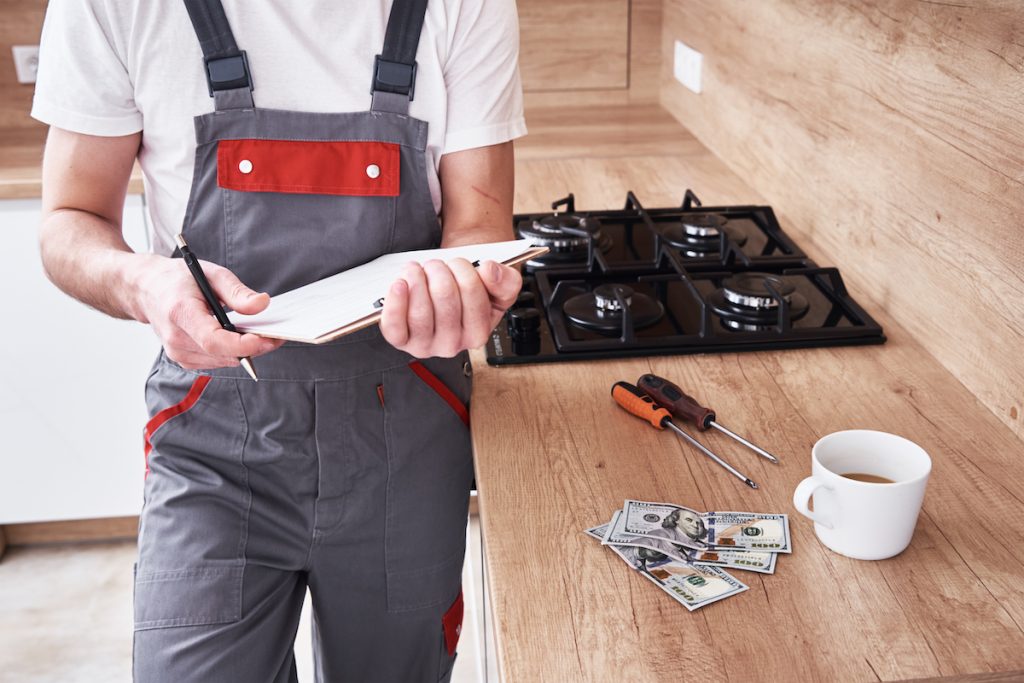 plumber calculating what his trade service call fee will be