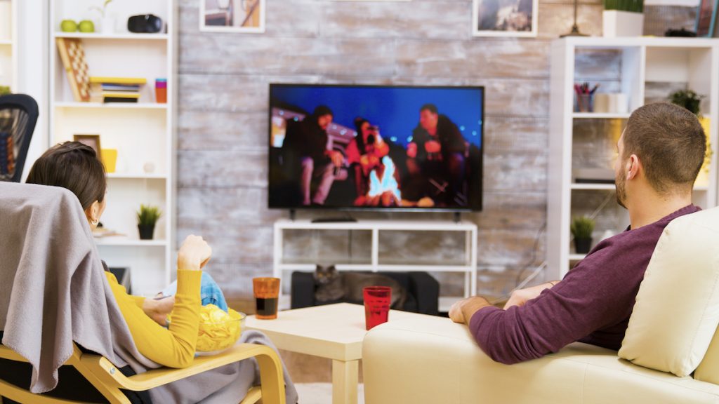 couple watching a company trying hvac marketing ideas on television