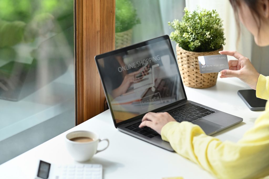 a woman operating self-service solutions on her laptop